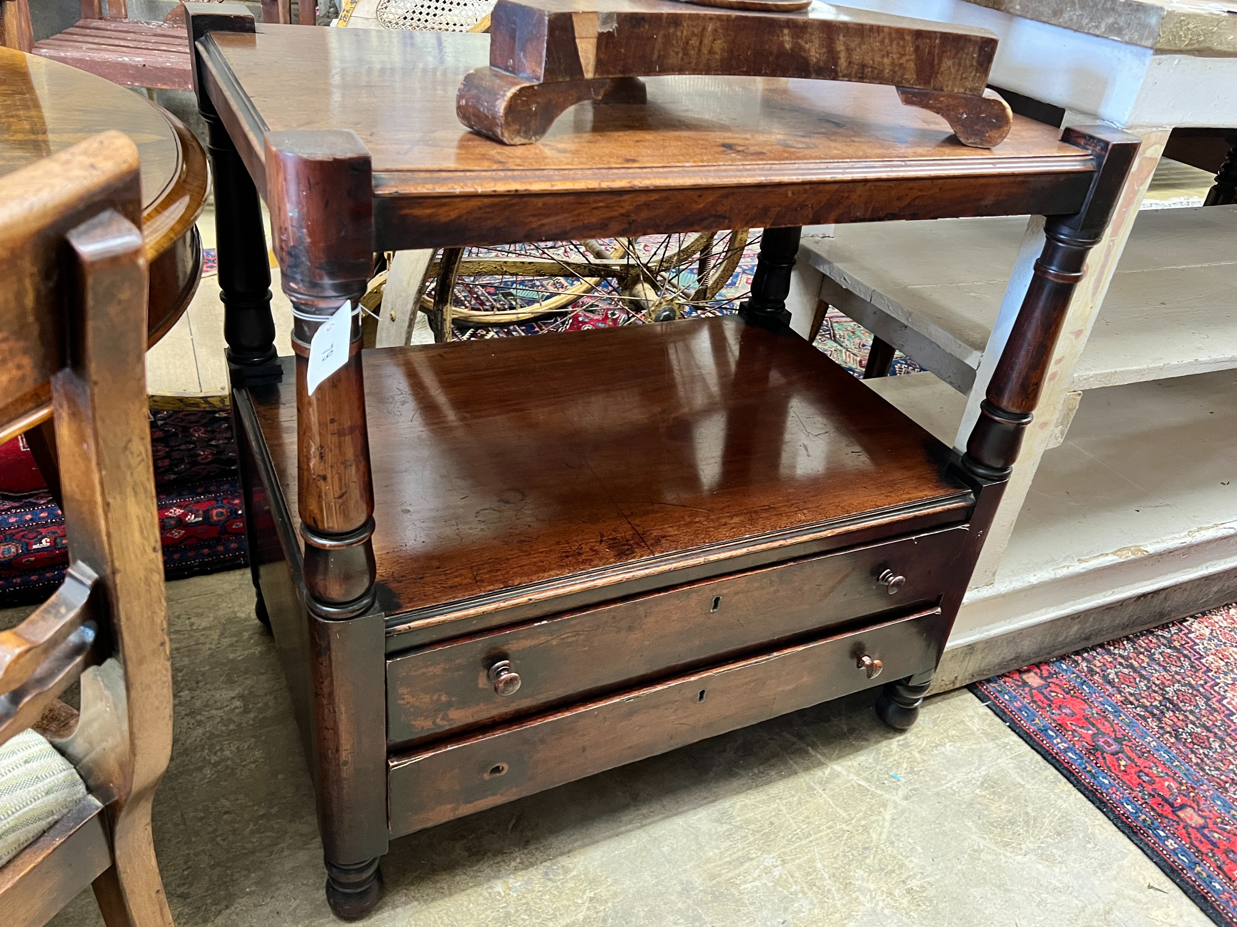 A Victorian mahogany two tier table (cut down buffet), width 76cm, depth 50cm, height 77cm together with a mid Victorian oval mahogany tea table